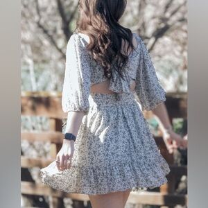 White dress with black flowers